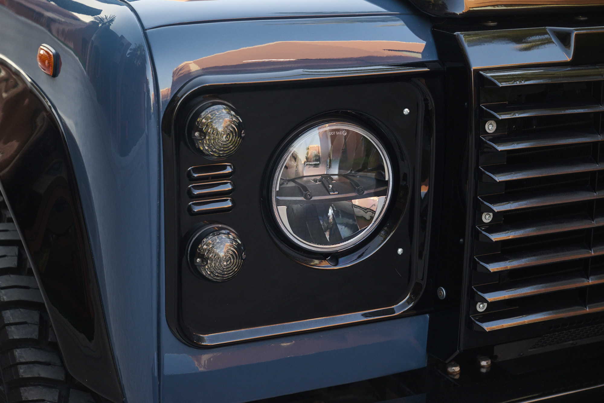 Blue Defender headlight close-up detail