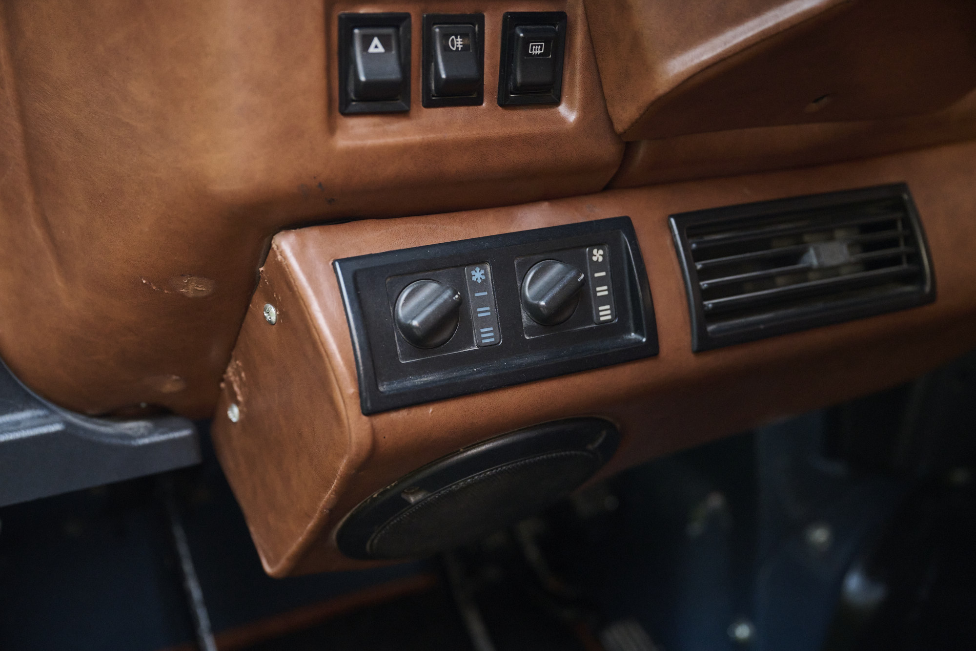 Burnt orange interior controls detail