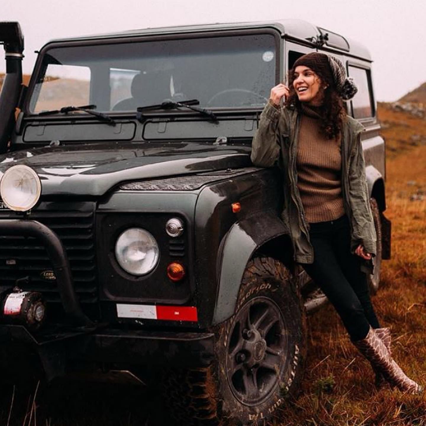 Green Defender 90 with winch and snorkel in hills