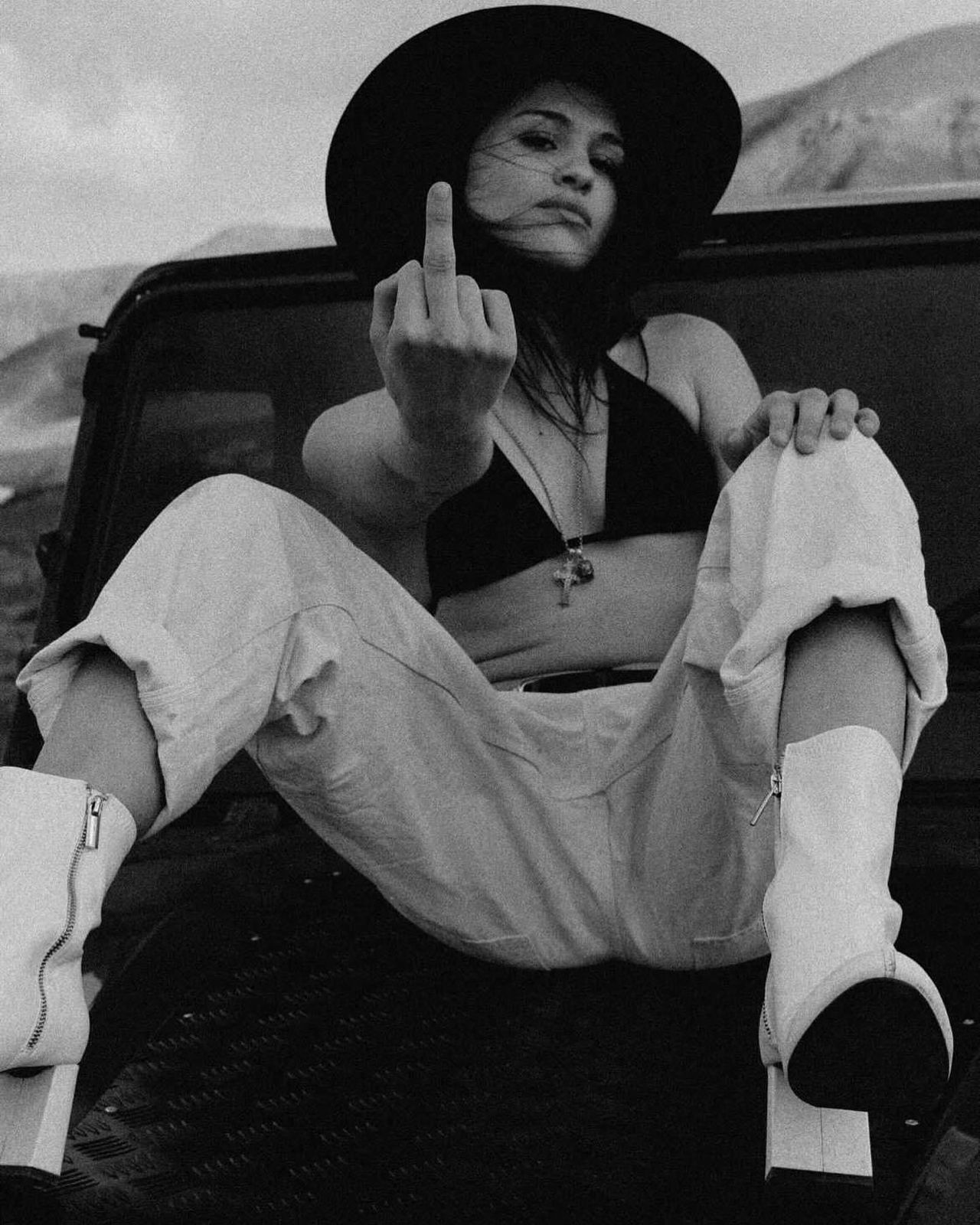 Black and white — woman on black Defender hood