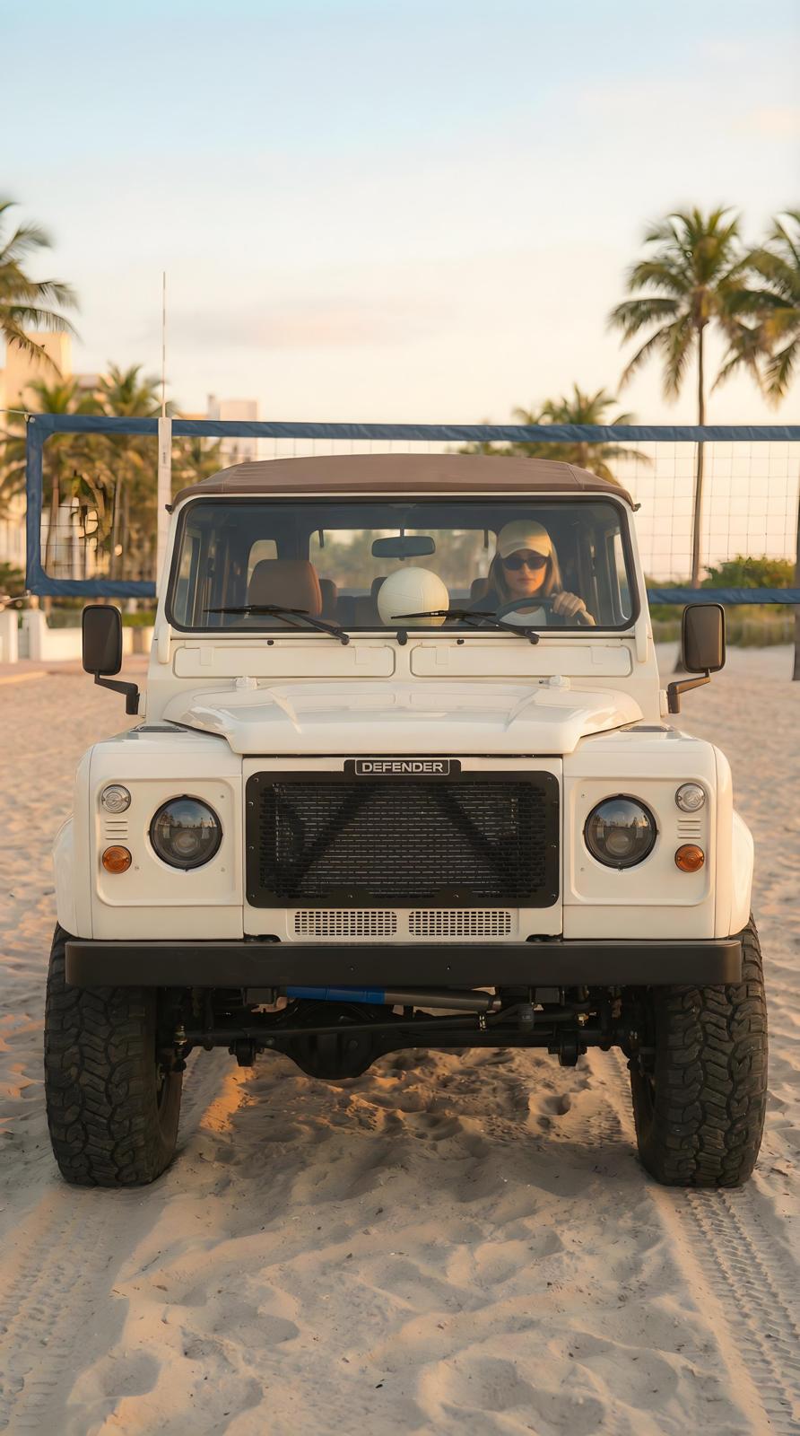 Cream Defender soft top on sand with volleyball net